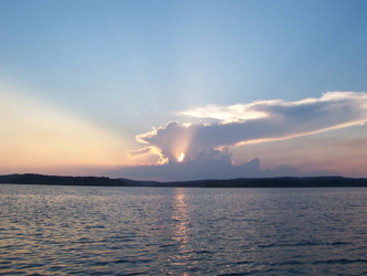 Incredible thunderhead with sunset over Bull Shoals Lake